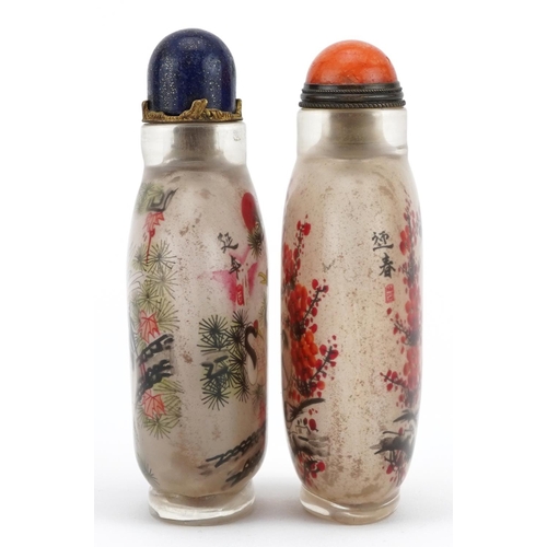 2316 - Two Chinese glass snuff bottles with stoppers hand painted with animals amongst flowers, each with c... 