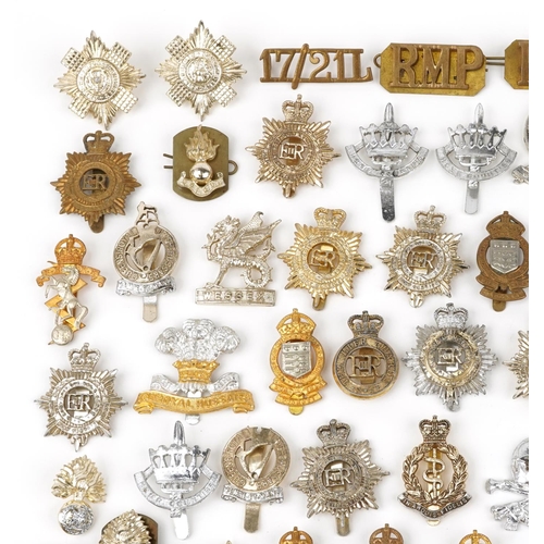 2415 - Large collection of British military interest cap badges including 10th Royal Hussars and Royal Engi... 