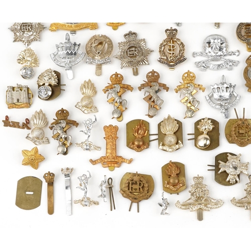 2415 - Large collection of British military interest cap badges including 10th Royal Hussars and Royal Engi... 