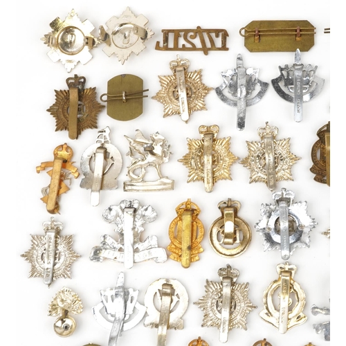 2415 - Large collection of British military interest cap badges including 10th Royal Hussars and Royal Engi... 