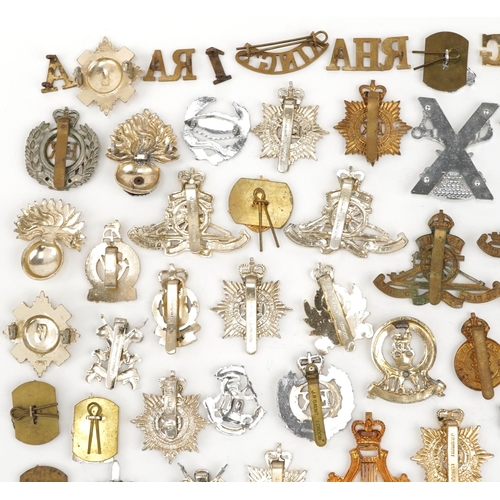 2416 - Large collection of British military interest cap badges including Yorkshire Regiment, Army Catering... 