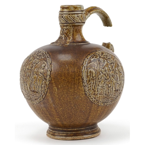 343 - Antique Bellarmine jug decorated in relief with mask and nude females, 21.5cm high