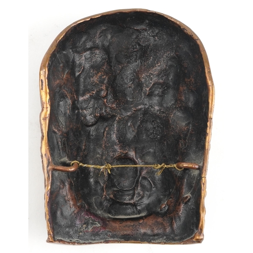 244 - Antique Tibetan or Indian patinated bronze mask of Bhairava with silver eyes and teeth, 13.5cm high