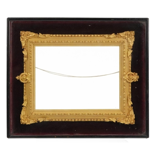 357 - 19th century Gesso frame housed in an ebonised display case with red velvet mount, overall 34cm x 29... 