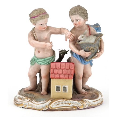 275 - Meissen, 19th century German porcelain figure group of two Putti and rabbit beside a hutch, blue cro... 