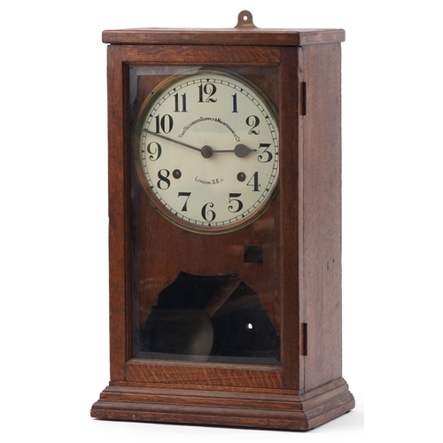 131 - Oak cased Time Recorder Supply Maintenance Co clocking in machine with circular dial having Arabic n... 