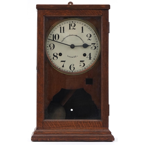 131 - Oak cased Time Recorder Supply Maintenance Co clocking in machine with circular dial having Arabic n... 