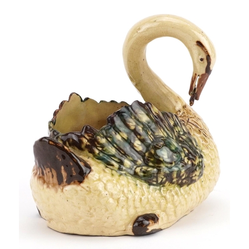 344 - 19th century slipware style cache pot in the form of a swan with a fish, 18cm wide