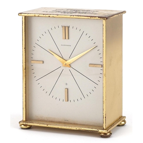 137 - Brass eight day mantle clock retailed by Garrard with silvered dial and presentation inscription, en... 