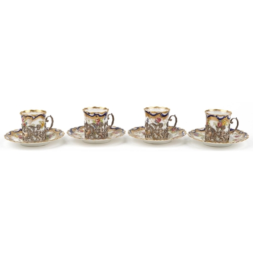 167 - Set of four Edwardian Aynsley coffee cans with saucers having silver cupholders embossed and pierced... 