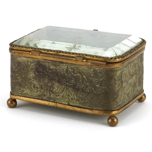 500 - 19th century European foliate brass jewel casket with bevelled glass and silk lined button back inte... 