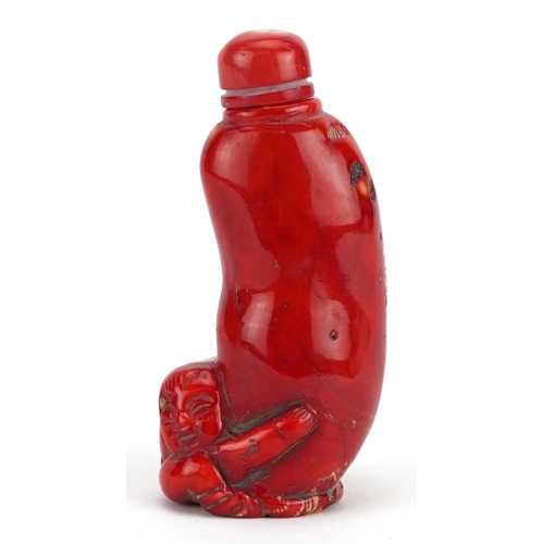 2373 - Chinese carved coral snuff bottle with stopper, 11cm high