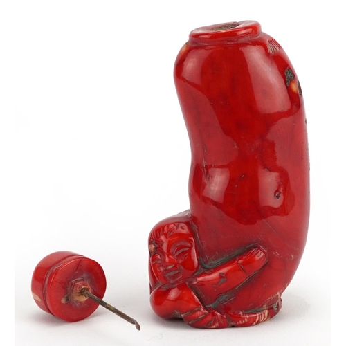 2373 - Chinese carved coral snuff bottle with stopper, 11cm high