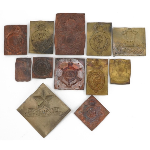 2430 - Twelve military interest metal cap badge type plaques including The Cameroonians, Perth Highland Rif... 