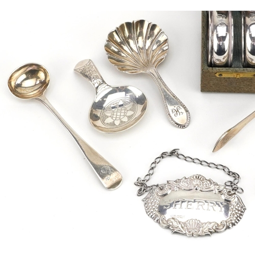 191 - Georgian and later silver objects including two caddy spoons, sugar tongs, sherry decanter label, a ... 