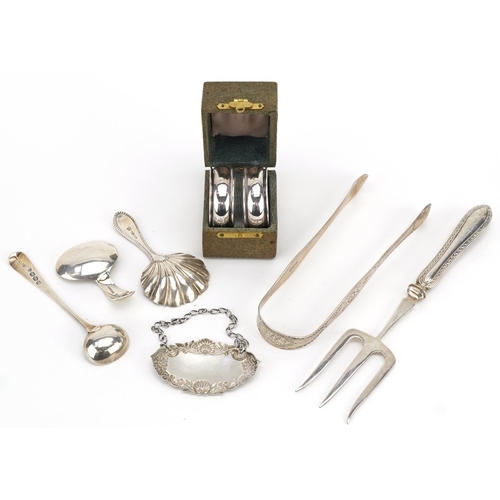 191 - Georgian and later silver objects including two caddy spoons, sugar tongs, sherry decanter label, a ... 