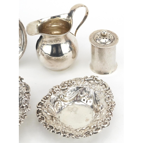 227 - Edwardian and later silver objects comprising a pair of pierced and embossed bonbon dishes, Edward V... 