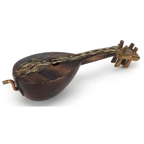 370 - 19th century novelty metal tape measure in the form of a mandolin, 7cm in length