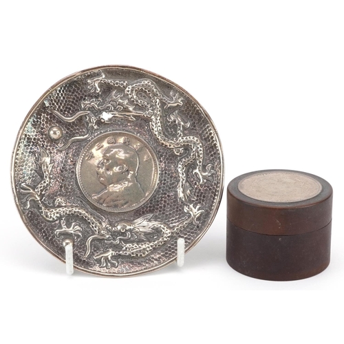 179 - Chinese unmarked silver dragon dish inset with a Fat Man dollar and a hardwood cylindrical box inset... 