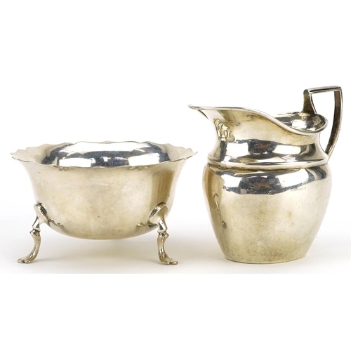 403 - Florence Warden, Victorian silver cream jug and a circular silver three footed sugar bowl by George ... 