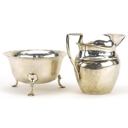 403 - Florence Warden, Victorian silver cream jug and a circular silver three footed sugar bowl by George ... 