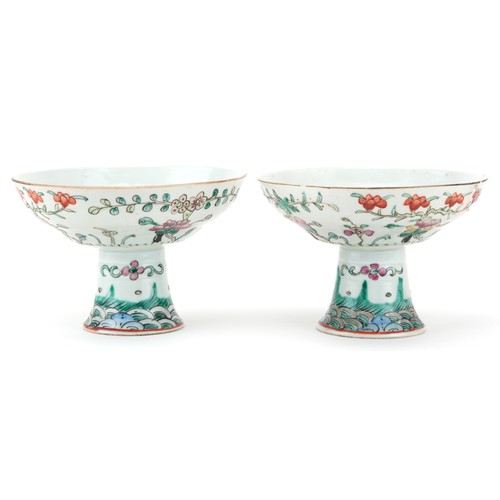 316 - Pair of Chinese porcelain stem bowls hand painted in the famille rose palette with flowers, each 14c... 