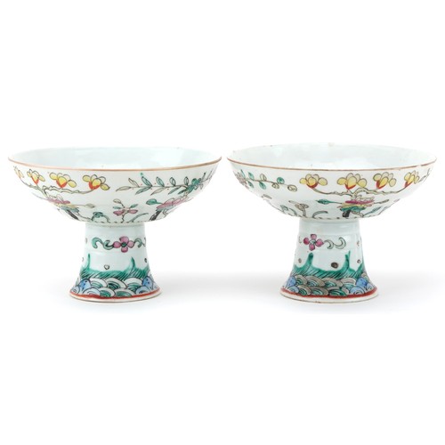 316 - Pair of Chinese porcelain stem bowls hand painted in the famille rose palette with flowers, each 14c... 