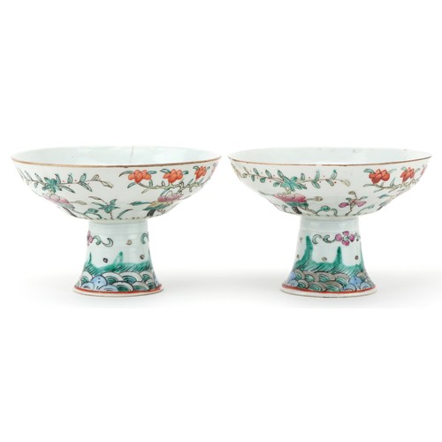 316 - Pair of Chinese porcelain stem bowls hand painted in the famille rose palette with flowers, each 14c... 