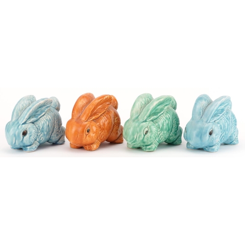 446 - Four early 20th century art pottery rabbits, possibly Sylvac, 13cm in length