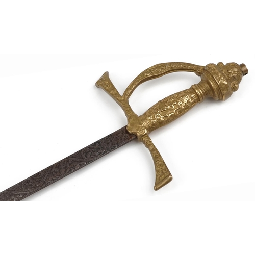 2501 - Military interest rapier type sword with engraved steel blade and brass handle, 97cm in length