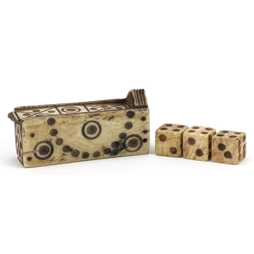 373 - Set of 19th century prisoner of war bone dice housed in a carved bone cradle with slide lid, 5cm in ... 