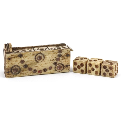 373 - Set of 19th century prisoner of war bone dice housed in a carved bone cradle with slide lid, 5cm in ... 