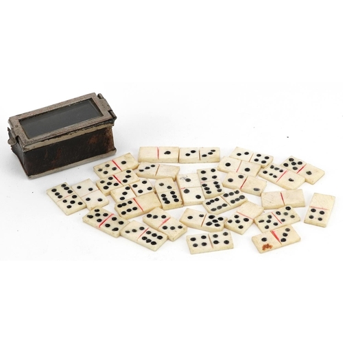 372 - 19th century set of prisoner of war carved bone Dominoes with container, each Domino approximately 1... 