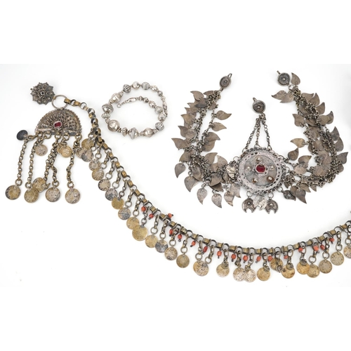 253 - Tribal interest unmarked silver and white metal jewellery including Indian drop earring set with red... 