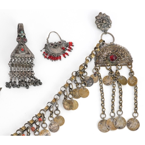 253 - Tribal interest unmarked silver and white metal jewellery including Indian drop earring set with red... 