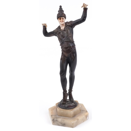 2361 - Patinated metal Art Deco style sculpture of a Pierrot dancing raised on a hexagonal stepped onyx bas... 