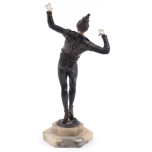 2361 - Patinated metal Art Deco style sculpture of a Pierrot dancing raised on a hexagonal stepped onyx bas... 