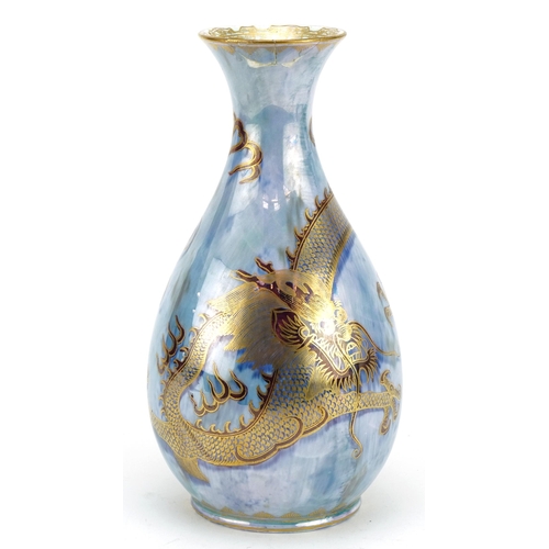 217 - Daisy Makeig-Jones for Wedgwood, ordinary luster vase hand painted and gilded with a dragon chasing ... 