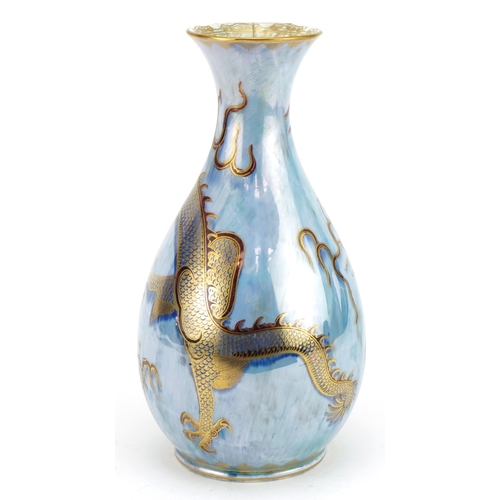 217 - Daisy Makeig-Jones for Wedgwood, ordinary luster vase hand painted and gilded with a dragon chasing ... 