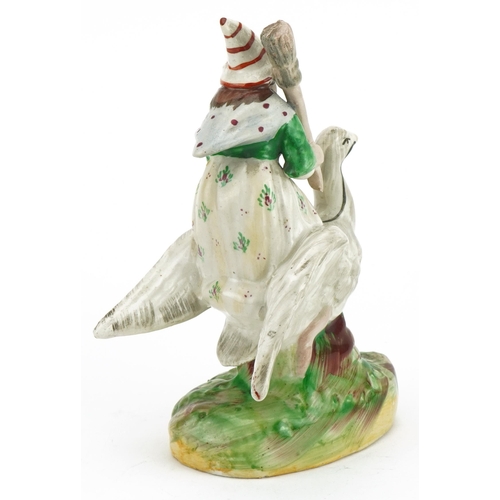 168 - Victorian Staffordshire pottery figure of Mother Goose, 18.5cm high