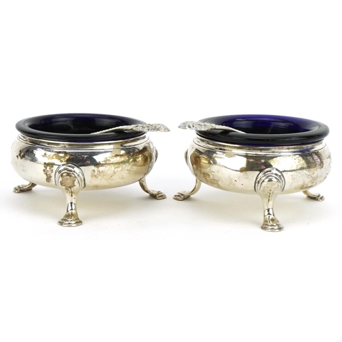 192 - David Hennell I, pair of George II circular silver three footed salts with blue glass liners and a p... 