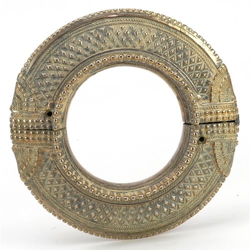 242 - Large 18th/19th century Persian brass anklet, 17cm in diameter