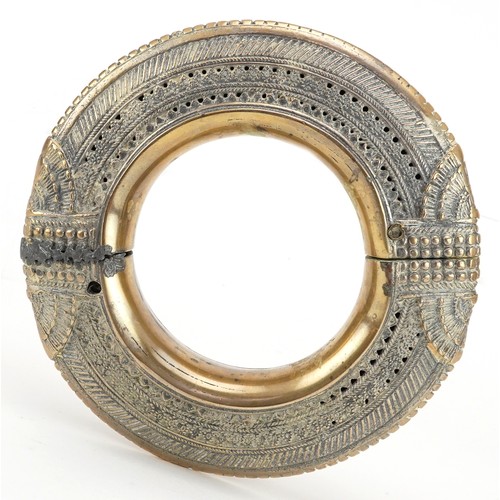 242 - Large 18th/19th century Persian brass anklet, 17cm in diameter