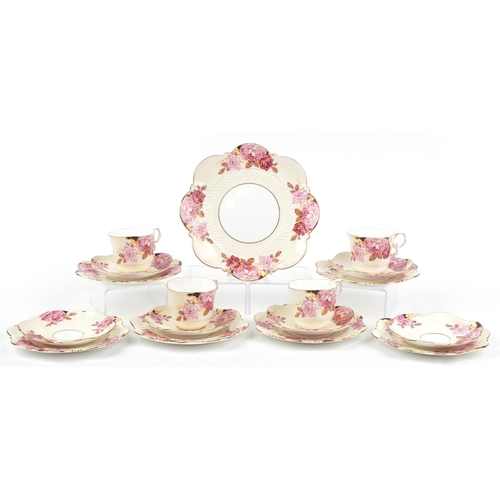 633 - Aynsley teaware hand painted with roses including four trios, pattern no B4773, the largest 22cm in ... 