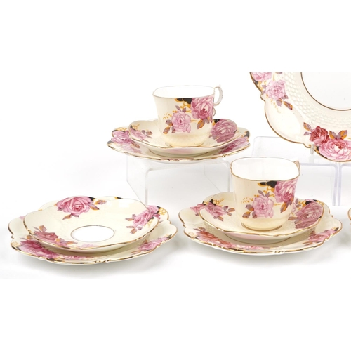 633 - Aynsley teaware hand painted with roses including four trios, pattern no B4773, the largest 22cm in ... 