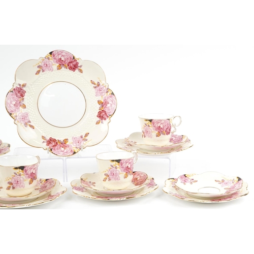 633 - Aynsley teaware hand painted with roses including four trios, pattern no B4773, the largest 22cm in ... 