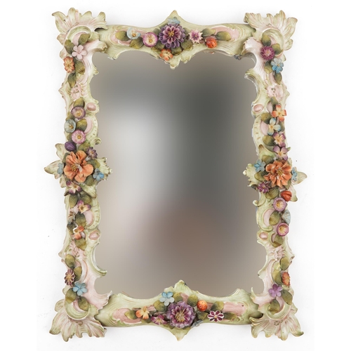 523 - 19th century German floral encrusted porcelain wall mirror with bevelled glass, 44cm x 33cm
