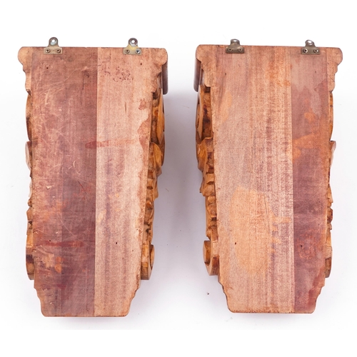 173 - Pair of hardwood corbels carved with foliage, each 35.5cm high