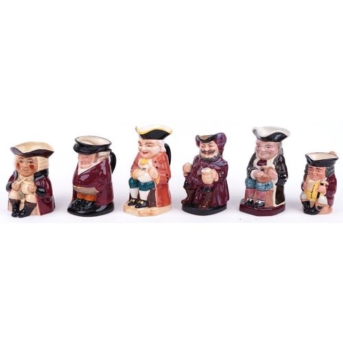 663 - Six porcelain Toby jugs, one musical including three Royal Doulton, the largest 23cm high