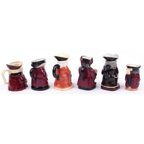 663 - Six porcelain Toby jugs, one musical including three Royal Doulton, the largest 23cm high